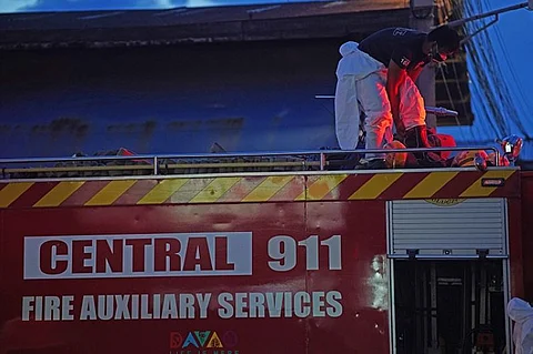 DAVAO. Fireman of Davao City Central 911 wears his protective suit on board a fire engine in preparation for the cleaning of Agdao Public Market in Davao City. Agdao, together with other markets, follows regular cleaning and disinfection schedules to ensure the safety of Dabawenyos. (Macky Lim)