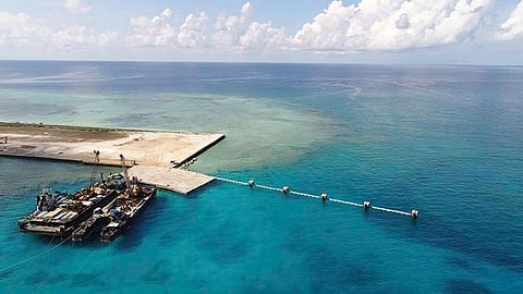 PAG-ASA ISLAND. In this handout photo provided by the Department of National Defense PAS, ships carrying construction materials are docked at the newly built beach ramp at the Philippine-claimed island of Pag-asa, also known as Thitu, in the disputed South China Sea on Tuesday, June 9, 2020. (AP)