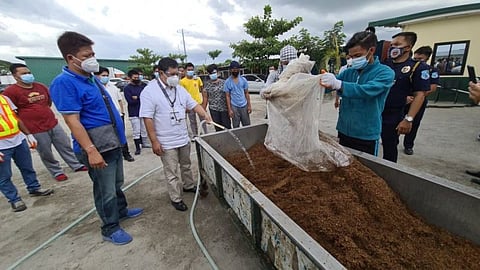 PAMPANGA. Bureau of Customs Port of Aparri District Collector Arienito Antonio Claveria and GreenLeaf 88 owner Robert Gaza lead the condemnation of P1.3 billion worth of raw materials, tax stamps, filters and other paraphernalia used to manufacture fake cigarettes. (Chris Navarro)
