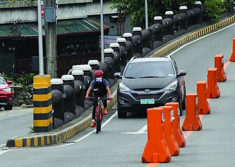 BAGUIO. While Baguio City has yet to designate bike lanes in major thoroughfares, the City Council is looking to pass a bike safety ordinance in order to protect their life and limb while on the road. (Jean Nicole Cortes)