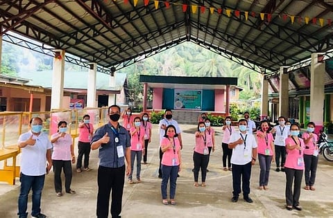 LEYTE. Schools Division Superintendent Dr. Manuel Albaño (front, in blue polo shirt) and Administrative Officer Alvin Tantuan (front, left), along with the faculty members of Marao National High School in Inopacan town, show their thumbs-up sign on their readiness in the opening of classes under the new normal. (Photo courtesy of Freddie Timon)