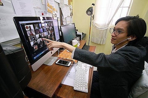 ONLINE TEACHING WEBINAR. Prof. Junley Lazaga of the University of Philippines (UP)-Baguio along with colleagues across the UP system gets skills upgrade on how to hold an online class through a webinar. Lazaga along with other educators are now shifting their teaching style to cope with the 'new normal' of conducting remote classes through the internet. (Photo by JJ Landingin)