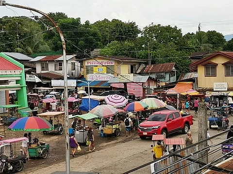CRITICAL ZONE. Situation in Barangay Ma-ao in Bago City hours prior to the implementation of lockdown due to the rising Covid-19 local transmission cases in the area on September 7, 2020. Residents were observed buying food and other commodities. An influx of people at a money remittance service provider was also noticed. (Orlean Omarrementeria Photo)