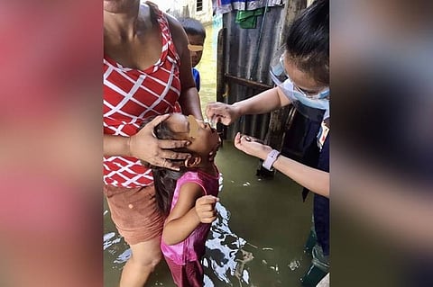 PAMPANGA. A Kapampangan child receives a polio shot to protect him from the outbreak of the virus during the house-to-house vaccination conducted by provincial health workers in partnership with DOH. (Pampanga PHO)
