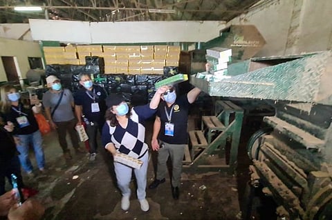 FAKE CIGARETTES. Deputy Collector Maita Acevedo of the Bureau of Customs Port of Subic and lawyer Reynaldo Yacat, chief of Auction and Cargo Disposal Monitoring Division of AOCG, led Friday's condemnation of some 6,000 master cases of fake cigarettes worth P180 Million, which were brought to the Green Leaf 88 non-hazardous waste disposal in Porac, Pampanga. (Photo by Chris Navarro)