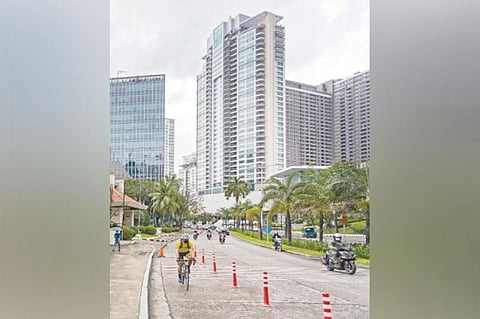 FOR CYCLISTS. The seven-kilometer bike lane network at the Cebu Business Park is physically marked by safety bollards. / CONTRIBUTED