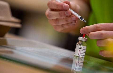 BELGIUM. A pharmacist prepares to fill a syringe with the AstraZeneca Covid-19 vaccine at the Vaccine Village in Antwerp, Belgium on Tuesday, March 16, 2021. (AP)