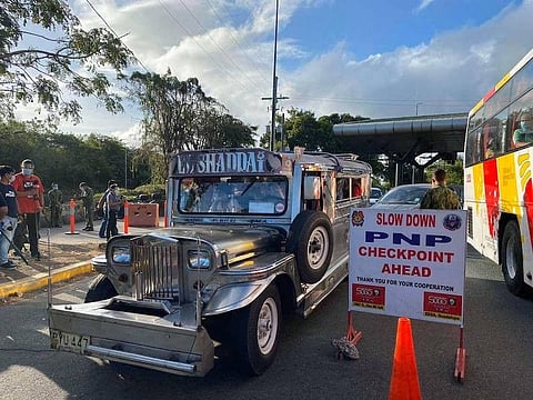 MANILA. Police inspect vehicles passing through a checkpoint in NCR+ to ensure that only authorized persons outside residence step out of their homes during the Holy Week lockdown from March 29 to April 4, 2021. (Third Anne Peralta-Malonzo)