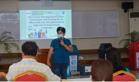TALISAY. Janet P. Estimar, team leader of the Eco-waste Management Team, gives a lecture presentation. (Contributed photo)