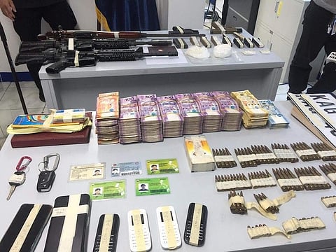 MANILA. Illegal firearms, ammunition, drugs and other items were seized from two vehicles believed to be owned by a former town mayor in Maguindanao, who was also a former Special Action Force personnel. (Third Anne Peralta-Malonzo)