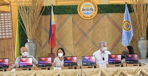 NEGROS. Governor Eugenio Jose Lacson spearheaded the turnover of the financial assistance and laptops to the said beneficiaries that aim to improve the learnings. (Richard Malihan photo)