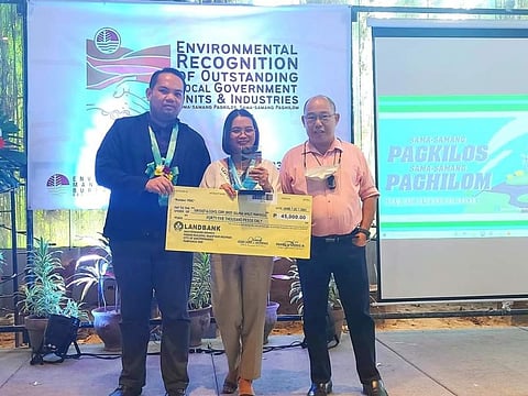 EMB AWARDEE. Representatives of Far East Alcohol Corporation led by its PCO Mercy Simon received a plaque and cheque from EMB after being awarded Outstanding Practice in Biogas Digester Operations. (Contributed photo)
