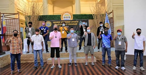 NEGROS OCCIDENTAL. Gov. Eugenio Jose V. Lacson (3rd from left) is joined by Provincial Sports Coordinator Tony Agustin (4th from right), champion IM Joel Pimentel (4th from left), and the winners of the  1st Governor Eugenio Jose V. Lacson Chess Tournament - Open category. (Fred Dizon Photo)