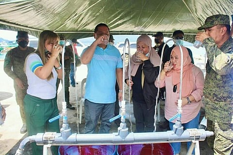 DESALINATION MACHINES. The Ministry of the Interior and Local Government in the Bangsamoro Autonomous Region in Muslim Mindanao (MILF-Barmm) releases three desalination machines on August 28, 2021 to the Provincial Government of Sulu. A photo handout shows Sulu and military officials taste the water processed by the desalination machine. (SunStar Zamboanga)