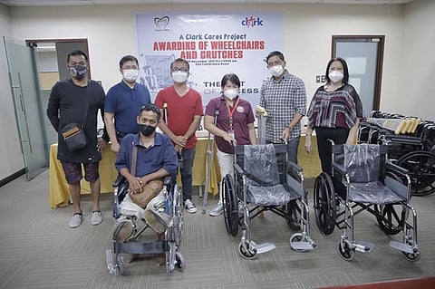GIFT OF ACCESS. Clark Development Corporation (CDC) President and CEO Manuel R. Gaerlan (2nd from right) with CDC Vice President for Admin and Finance Group (AFG) Mariza Mandocdoc (rightmost), and CDC External Affairs Department (EAD) Assistant Vice President Rommel Narciso (leftmost) presented the assistive devices donated by CDC to the Persons with Disability Affairs Office of Angeles City (PDAO–AC). The donated materials were received by PDAO-AC Disability Affairs Officer II Alma Vital (2nd from left). (CDC-CD)
