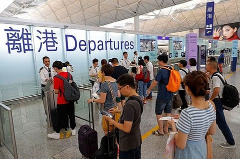 HONG KONG. Travelers check in at the departure gates at the airport in Hong Kong, Wednesday, August 14, 2019. (AP)