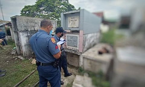 BACOLOD. Darwin Nuñez, 22, had a slit throat while his intestines were already protruding when his body was found on top of a tomb at the Barangay Granda public cemetery Wednesday, March 16. (Contributed photo)