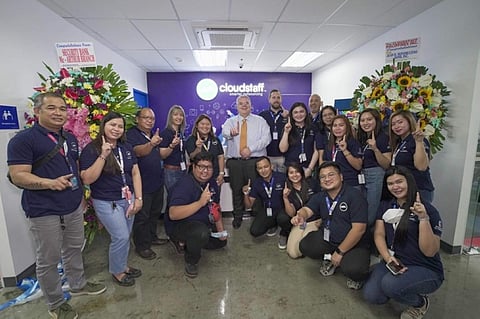 AT THE CLOUDSTAFF OFFICE. Cloudstaff Chief Executive Officer Lloyd Ernst joins personnel during the opening of the company's CRK14-15 Office inside the Entec 2 Building at the Nepo Center in Angeles City. (Charlene A. Cayabyab)