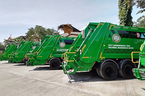 NEW TRUCKS. Twelve new compactor trucks of the City Environment and Natural Resources Office (CENRO) are currently displayed in front of the City Hall of Davao along San Pedro Street on Wednesday, September 14. The newly purchased trucks are expected to help address the city's garbage collection problems. Solid waste management is one of the priorities under the administration of Mayor Sebastian Duterte.