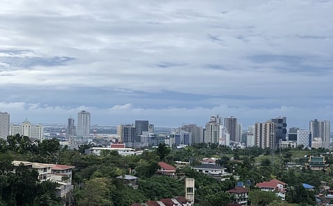 ECONOMIC OUTLOOK. This Dec. 24, 2022 photo shows the skyscrapers of Cebu City, the financial center of Cebu island, taken from the Taoist Temple. Cebuano businessmen share mixed views on the economic outlook in 2023, the Year of the Rabbit in the Chinese lunar calendar. While economic recovery is expected to continue this year, challenges remain on the horizon, including rising inflation, fears of a global recession and growth slowdown of the Philippine economy. / Carlo Lorenciana