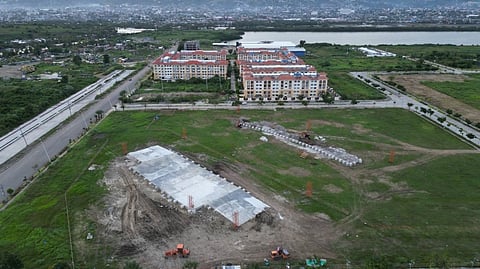 SINULOG STAGE. In this drone photo provided by the Cebu City Public Information Office on Wednesday, Jan. 4, 2023, construction workers work hard to finish the stage for this year's Sinulog Festival, which will be held at the South Road Properties on Jan. 15. But citizens are still wondering how the City plans to stabilize the ground where the stage will stand, especially since it is known to become muddy after a bout of rain. / Cebu City PIO