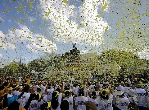 MANILA. In this February 25, 2013, file photo, yellow confetti rains on hundreds of people visiting the People Power Monument along Edsa Boulevard in Quezon City, Philippines, to celebrate the anniversary of the People Power Revolution. (AP)