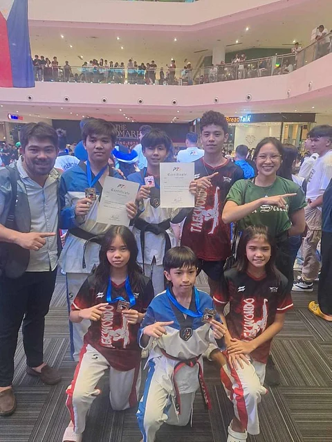 Front row, from left, Zyx Geocadin, Dondy Santillan Jr. and Katherine Mandal, standing, from left, Coach Vic Feria, Joshua Deita, Zane Olivo, Ethan Chavez and Asst Coach Angeline Alcantara.