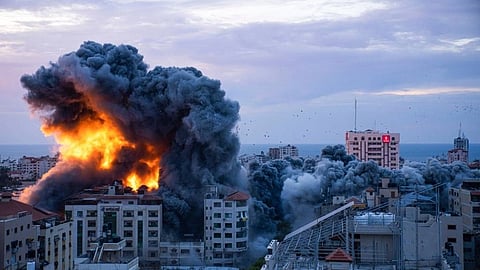 GAZA. Fire and smoke rises following an Israeli airstrike, in Gaza City, Saturday, Oct. 7, 2023. The militant Hamas rulers of the Gaza Strip carried out an unprecedented, multi-front attack on Israel at daybreak Saturday, firing thousands of rockets as dozens of Hamas fighters infiltrated the heavily fortified border in several locations by air, land, and sea, killing dozens and stunning the country. Palestinian health officials reported scores of deaths from Israeli airstrikes in Gaza.