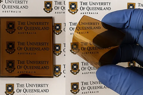 The AIBN research team showcasing Tin Halide Perovskite (THP) layers coated on a rigid glass substrate (on the left) and on a flexible plastic substrate (on the right).