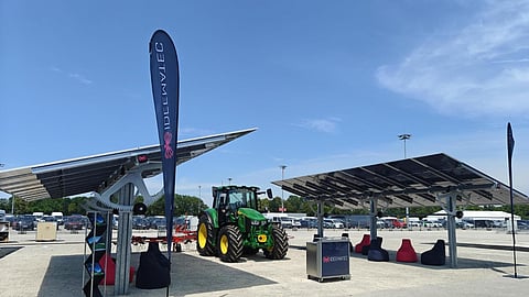 IDEEMATEC showcased its L:TEC Agri-PV tracker alongside a tractor to demonstrate the combined use of land for agriculture and solar power generation.