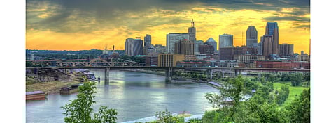 Xcel Energy’s 500 MW solar PV RFP says the capacity will be built on build and transfer basis in Sherco County, Minnesota and these projects must come online before December 31, 2023. Pictured is a river through the city under the bridge to St. Paul, Minnesota. (Photo Credit: www.goodfreephotos.com)
