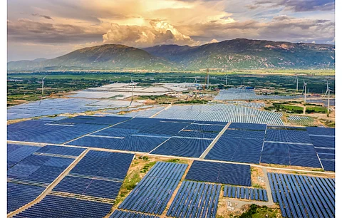 Renewable energy developers operating in Vietnam will not to be too happy with the NLDC’s decision to not include any solar or wind power plants to the 2022 plan. Pictured is a wind and solar installation in Vietnam. (Illustrative Photo; Photo Credit: Nguyen Quang Ngoc Tonkin/Shutterstock.com)