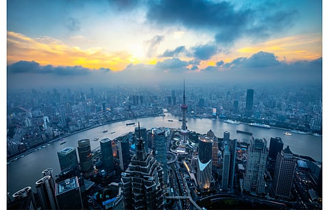As China goes about 450 GW of solar and wind power generation in the Gobi Desert, MOHURD is supporting with rooftop and BIPV solar through a new development roadmap for the 14th Five-Year Plan. Pictured is the skyline of Shanghai, China. (Photo Credit: Patrick Foto/Shutterstock.com)