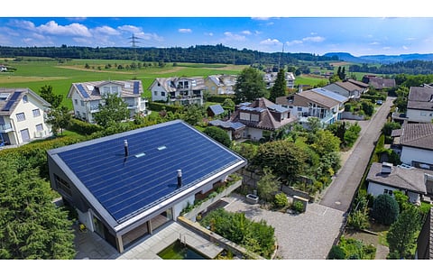 Pictured are solar panels installed on a rooftop in Switzerland. To encourage further installation of renewables, the Federal Council is amending its incentive policy. (Photo Credit: Visual Arts Sobotkiewicz/Shutterstock.com)