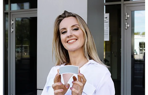 Pictured is Founder and CTO of Saule Technologies Olga Malinkiewcz with a grey perovskite module. The company is seeking a wider market for its perovskite technology through a partnership with Columbus Energy and Google Cloud. (Photo Credit: Saule Technologies)