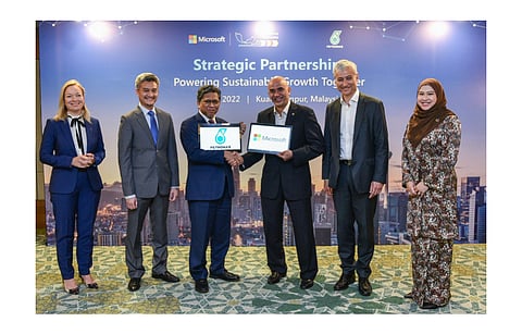 Pictured are representatives of Microsoft and Petronas signing co-operation agreements for solar power sourcing and co-development of digital solutions to help the latter in its decarbonization efforts. (Photo Credit: Microsoft)