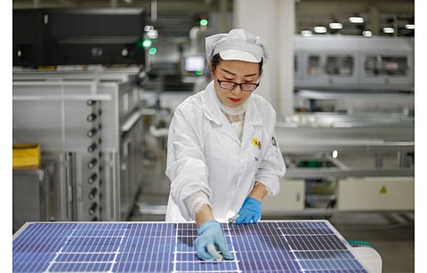 The promoters of Silicon Valen aim to grow Spanish solar PV manufacturing with a view to become independent of Chinese supply chain, reported local media. Pictured is a worker in a PV manufacturing facility in China’s Jiangxi province. (Illustrative Photo; Photo Credit: humphery/Shutterstock.com)