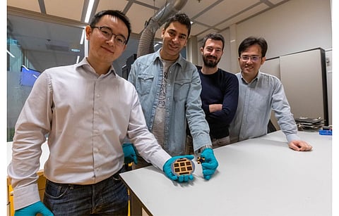 Solliance team with the high efficiency perovskite and silicon solar cell: from l to r, Yifeng Zhao (TU-Delft), Mehrdad Najafi (TNO), Valerio Zardetto (TNO) and Dong Zhang (TNO). (Photo Credit: Niels van Loon)
