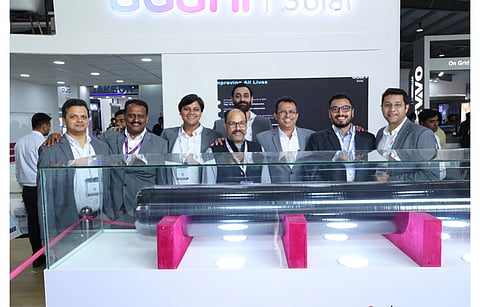 Adani Solar has completed the backward integration of ingot line infrastructure within 7 months. It recently unveiled the 1st large sized monocrystalline silicon ingot during Intersolar India (in the picture). (Photo Credit: Adani Solar/Twitter)