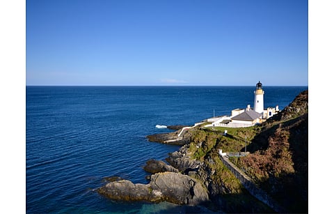 Manx Utilities was tasked with deploying 20 MW renewable energy capacity in the Isle of Man by 2026, but it proposed an improved target of 30 MW instead which has now been approved. Pictured is Douglas Lighthouse on the Isle of Man. (Photo Credit: tr3gin/Shutterstock.com)