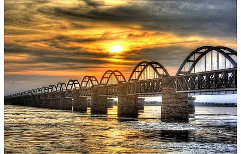 Pictured is a railway bridge between East Godavari and West Godavari in Rajahmundry town of Andhra Pradesh, where Triveni Glass Limited once used to operate its glass manufacturing fab. It has now proposed to establish a solar glass fab in East Godavari district. (Photo Credit: East Godavari District Administration)