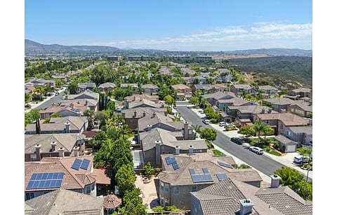 Sunrun says it started developing Shift soon after California finalized its net metering policy under NEM 3.0. Pictured is an aerial view of middle class residential villas with solar panels in California’s San Diego County. (Photo Credit: Unwind/Shutterstock.com)