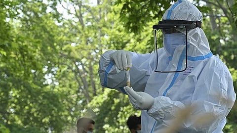 Health worker collecting the swab sample