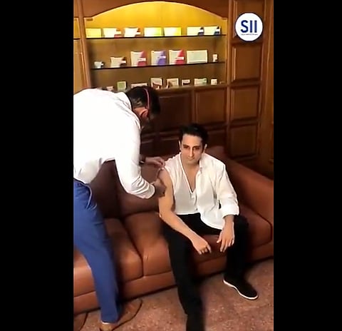 Adar Poonawalla, posted a video of him taking the first dose of Covishield. Here's the screenshot of the same