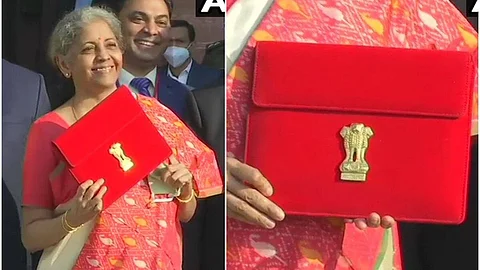 Finance Minister Nirmala Sitharaman showing tab to the media persons