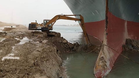 A part of the Taiwan-owned MV Ever Given (Evergreen) lodged sideways at Suez Canal. A small bulldozer was sent to dislodge the giant ship