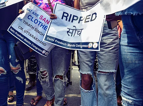 Delhi Pradesh Mahila Congress members take part in a protest against Uttarakhand Chief Minister Tirath Singh Rawat's remarks regarding ripped jeans, at Connaught Place in New Delhi, Friday, March 19, 2021.
