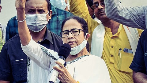 West Bengal Chief Minister Mamata Banerjee flashes victory after filing her nomination for the Nandigram seat