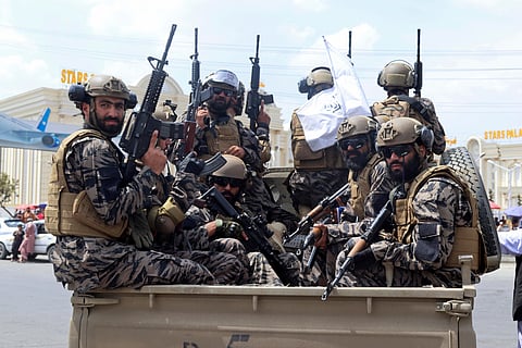 Taliban special force fighters arrive to the Hamid Karzai International Airport after the U.S. military's withdrawal