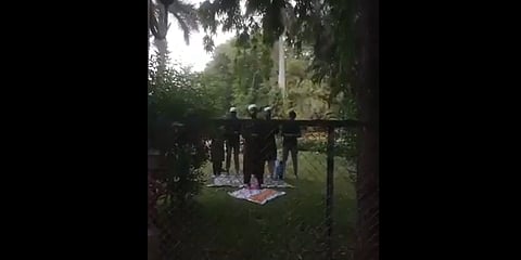 Video grab of unidentified individuals offering Namaz at Saras Baug Temple and garden premises
